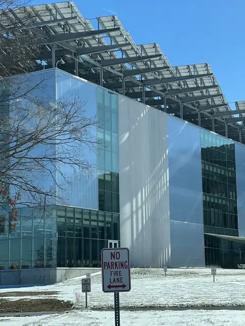 Sleek glass and solar power in a winter landscape.